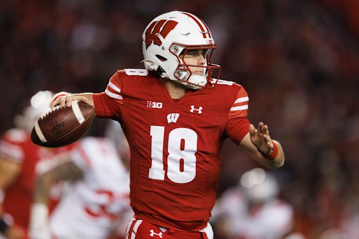 Oct 28, 2023; Madison, Wisconsin, USA; Wisconsin Badgers quarterback Braedyn Locke (18) throws a pass during the fourth quarter against the Ohio State Buckeyes at Camp Randall Stadium. Mandatory Credit: Jeff Hanisch-USA TODAY Sports